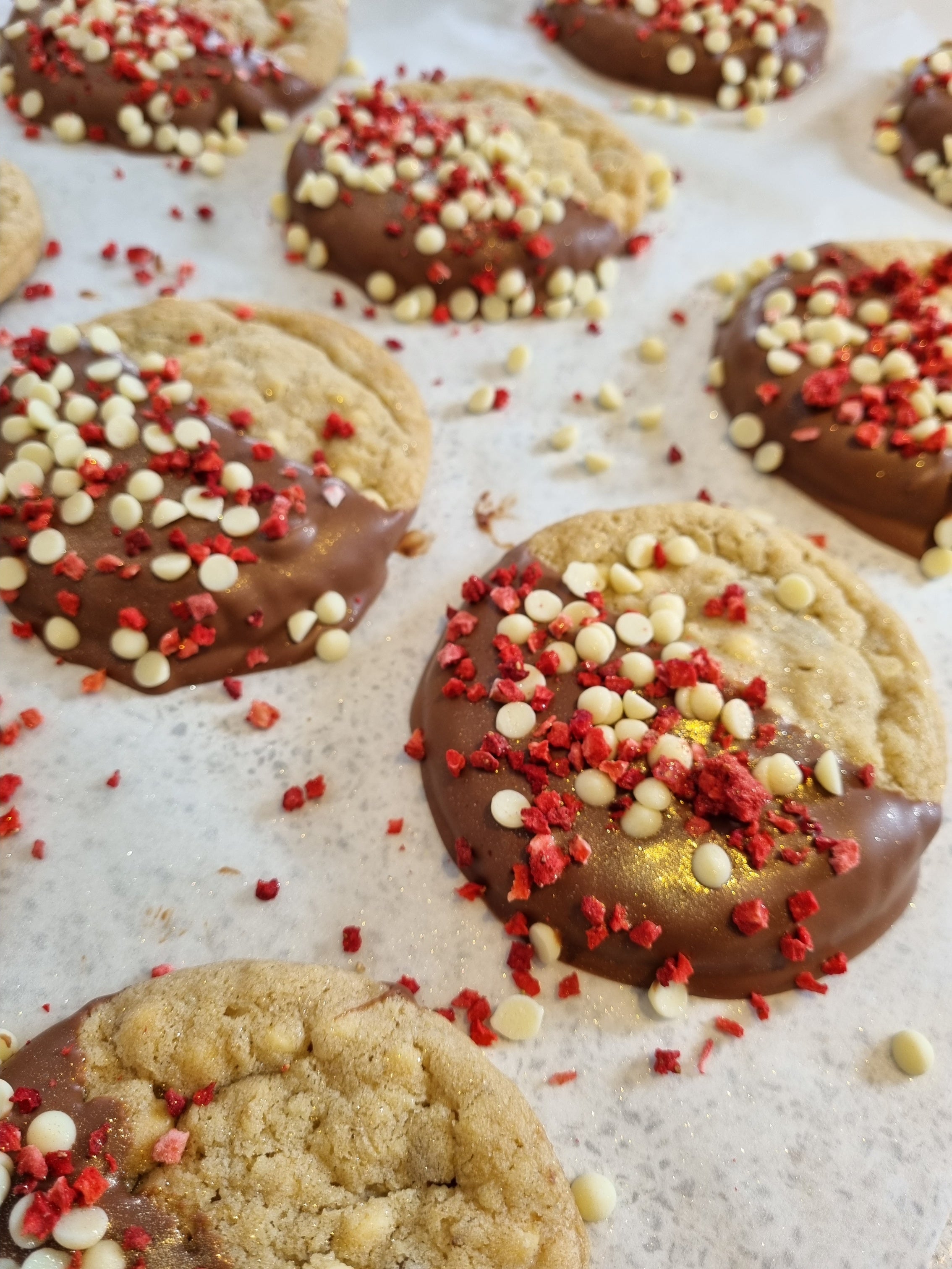 Mini Chocolate covered raspberry & white choc chip cookies on a table. Perfect for creating your own wedding dessert table.