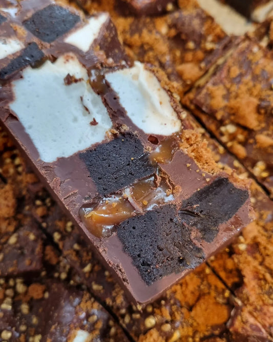 Close-up of a layered chocolate dessert with nuts and caramel